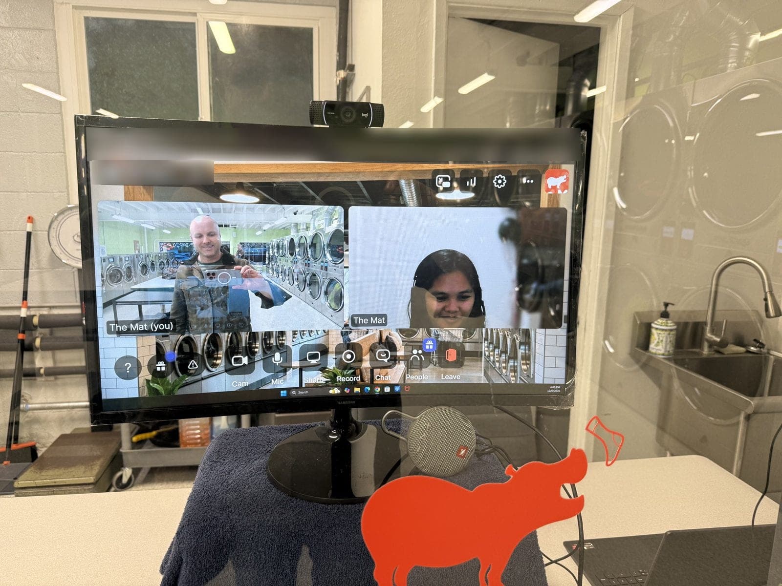 The Virtual Attendant screen inside The Mat, showing a live video call with a member of staff
