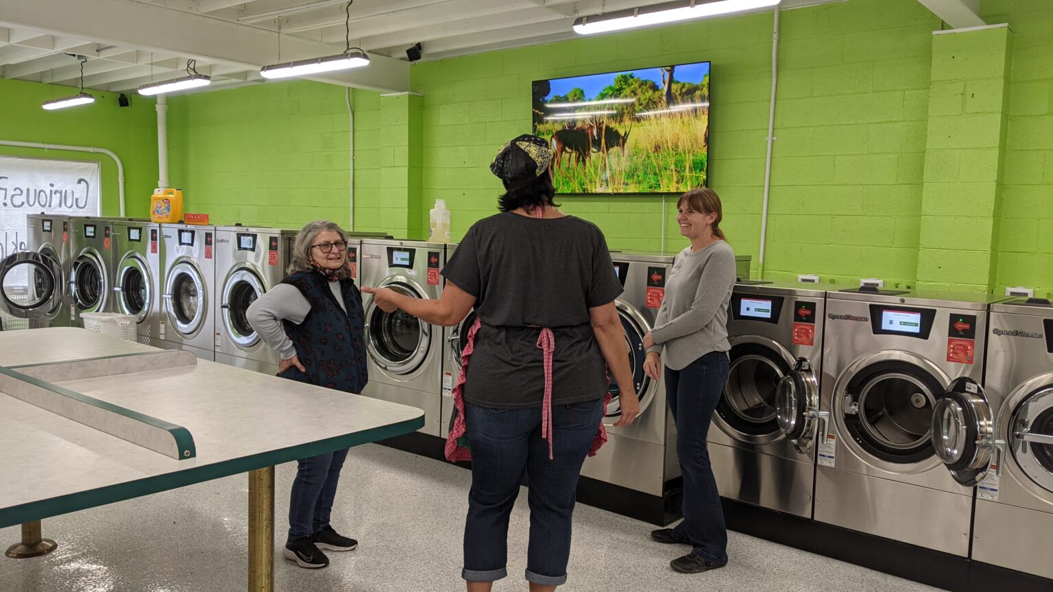 People Talking inside the Laundry Shop